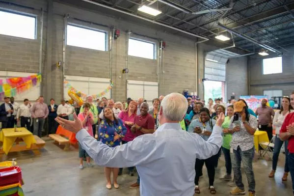 Mr. Jenkins in front of a group of employees enjoying a fiesta