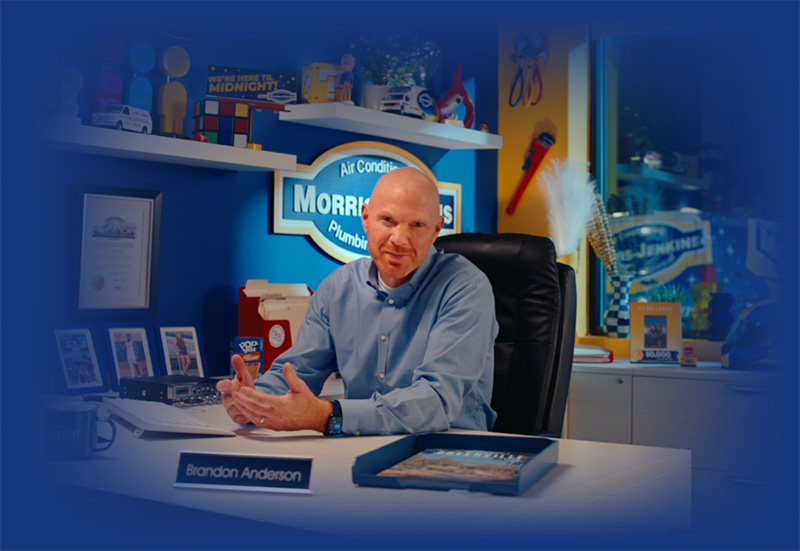 Brandon Anderson sitting at his desk