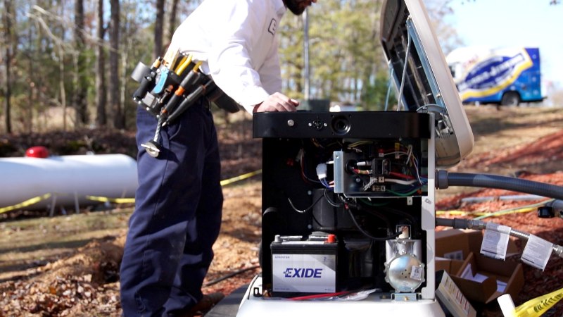 Tech inspecting open generator