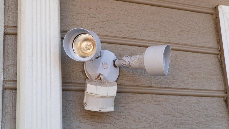 Outdoor motion detector light on house