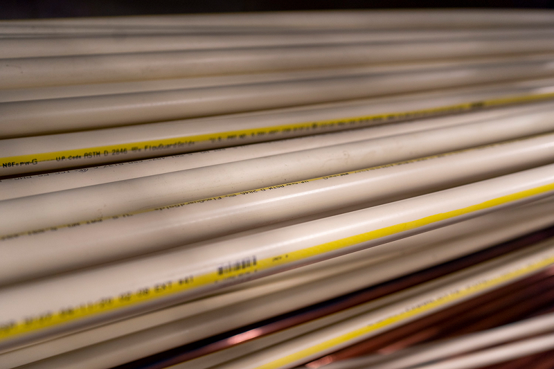 A shelf full of CPVC piping in the warenhouse