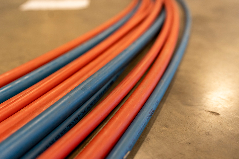 A row of red and blue PEX pipe