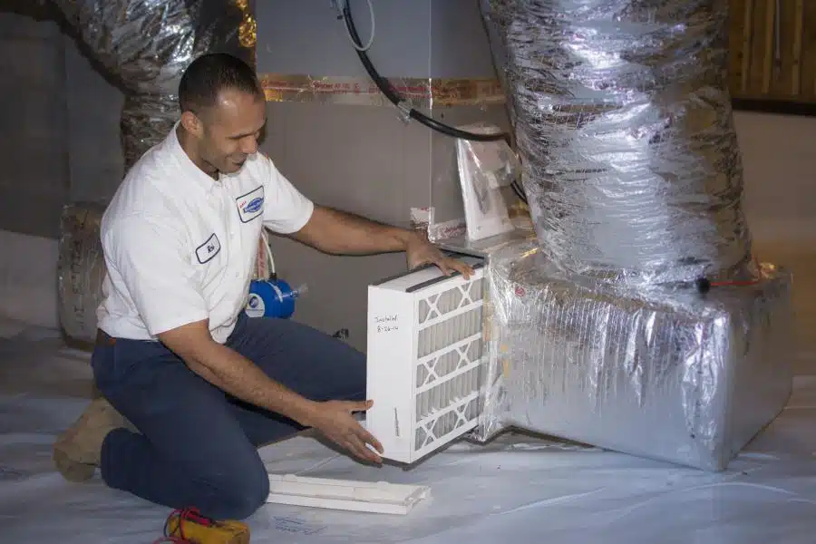 Morris-Jenkins technician installing a ductless air conditioning unit.