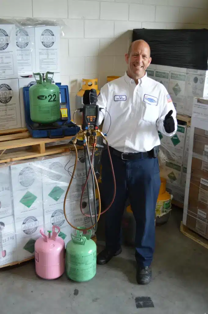 Morris-Jenkins service technician standing next to gas cylinders