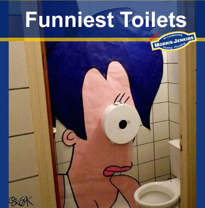A bathroom with a toilet with a cartoon character on it.