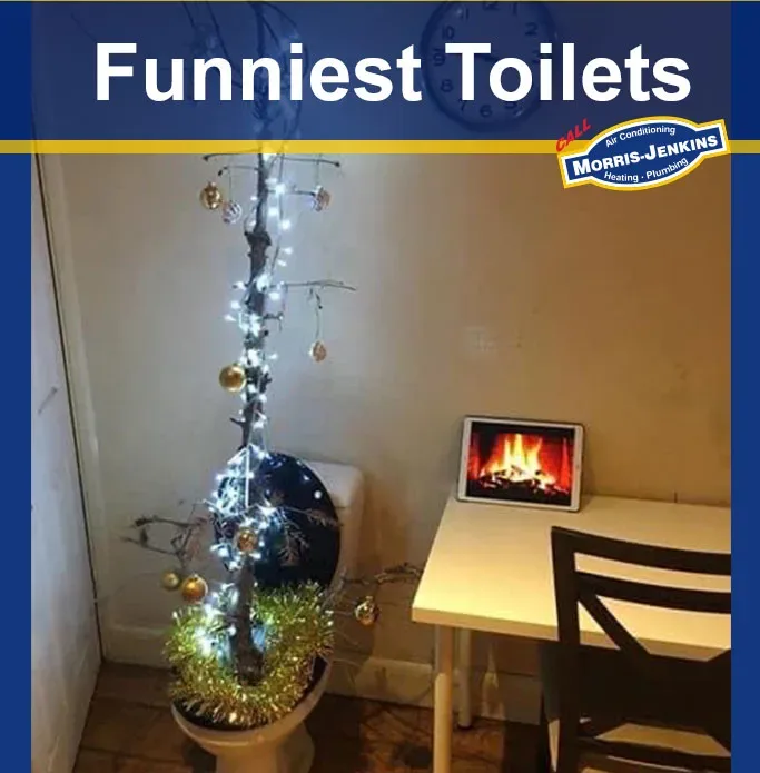 A toilet with a christmas tree in it.