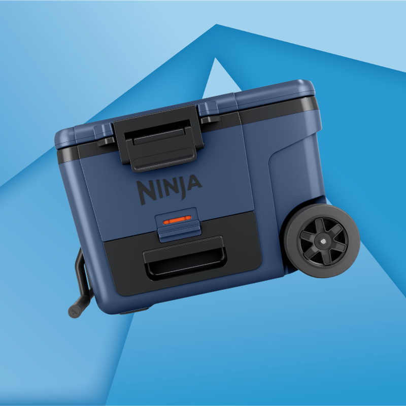 A blue and black Ninja-branded portable appliance with wheels and handle, shown against a geometric blue background.